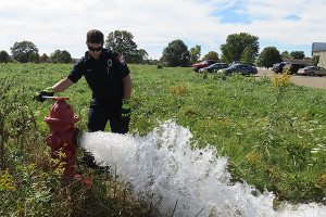 Fireman Lynch makes sure a hydrant is in good working order